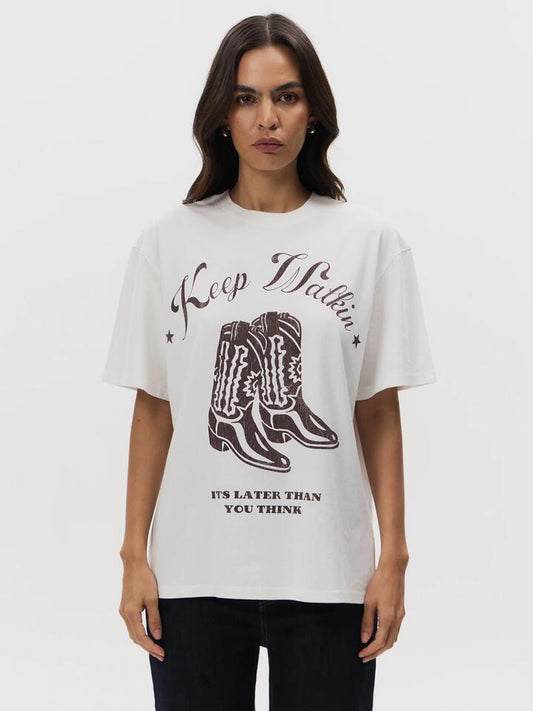 Image of a model wearing Tops. Productname: Lulu & Rose Keep Walkin Oversized Tee in OFF WHITE colour by brand - Lulu & Rose