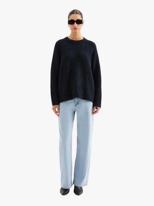 Image of a model wearing Tops. Productname: Nude Lucy Elias Knit in Ink colour by brand - Nude Lucy