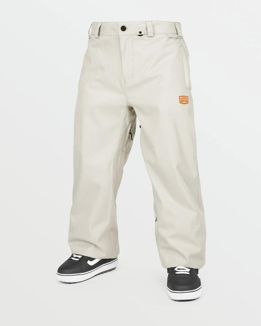 Image of a model wearing Pants. Productname: Volcom Mens Arthur 20K Snow Pants Stone - in Stone colour by brand - Volcom