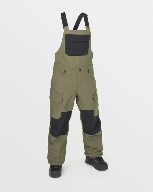 Image of a model wearing Pants. Productname: Volcom Womens Creston 3D Stretch Bib Snow Pants Ivy - in Ivy colour by brand - Volcom