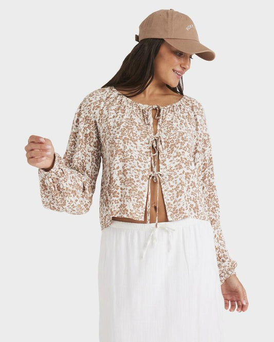 Image of a model wearing Tops. Productname: Roxy - Womens Kerlina Tie Top Long Sleeve Shirt - Cloud Dancer - in Cloud Dancer colour by brand - Roxy