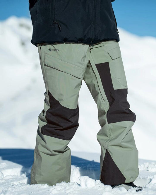 Image of a model wearing Pants. Product name - Volcom Womens V.Co At Stretch Gore-Tex Snow Pants Lichen Green in Lichen Green colour by brand - Volcom