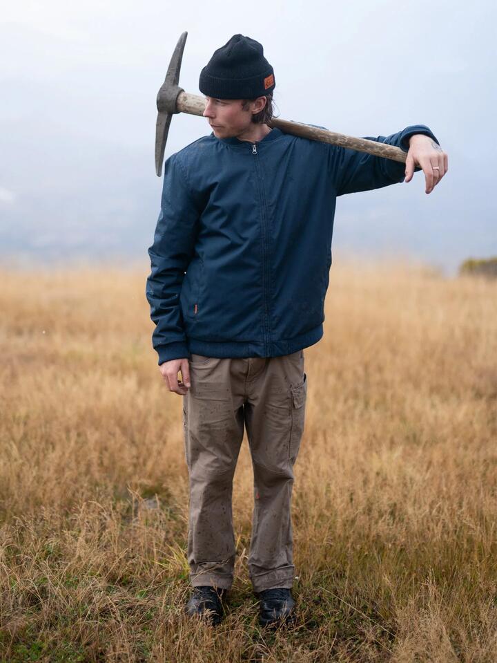 Image of a model wearing Uniforms & Workwear. Productname: Volcom - Mens Workwear Bomber Jacket - Navy - in Navy colour by brand - Volcom