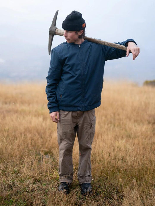 Image of a model wearing Uniforms & Workwear. Productname: Volcom - Mens Workwear Bomber Jacket - Navy - in Navy colour by brand - Volcom