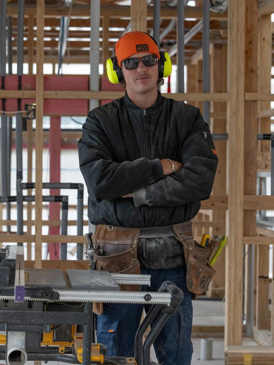 Image of a model wearing Uniforms & Workwear. Productname: Volcom - Mens Workwear Bomber Jacket - Black - in Black colour by brand - Volcom