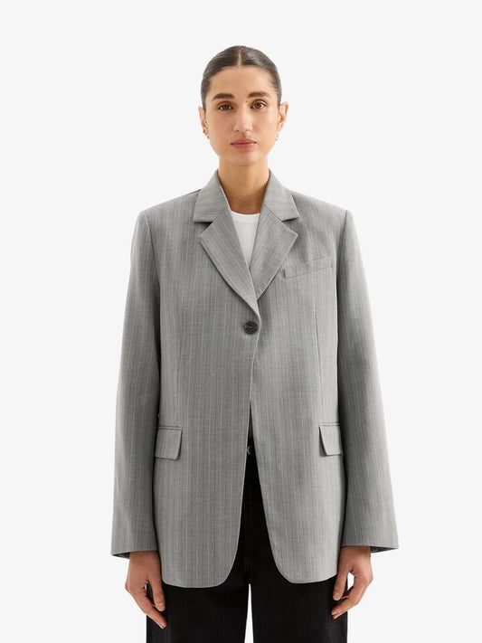 Image of a model wearing Outerwear. Productname: Nude Lucy Cilia Blazer in Steel Stripe colour by brand - Nude Lucy
