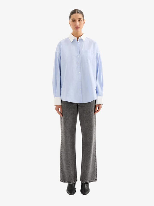 Image of a model wearing Tops. Productname: Nude Lucy Yuri Shirt in Chambray Stripe colour by brand - Nude Lucy