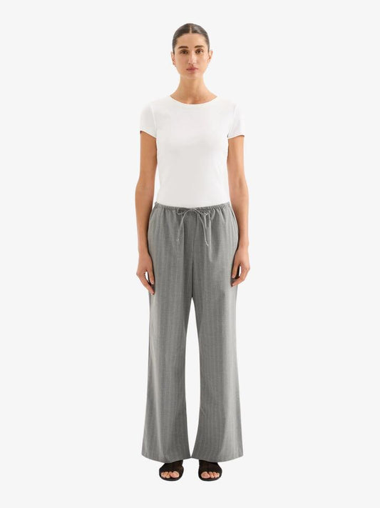 Image of a model wearing Pants. Productname: Nude Lucy Cilia Drawstring Pant in Steel Stripe colour by brand - Nude Lucy
