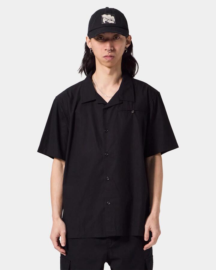 Image of a model wearing Tops. Productname: Former - Mens Rose Marilyn Short Sleeve Shirt - Black - in Black colour by brand - Former