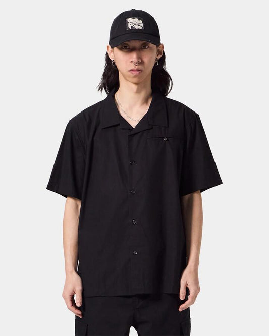 Image of a model wearing Tops. Productname: Former - Mens Rose Marilyn Short Sleeve Shirt - Black - in Black colour by brand - Former