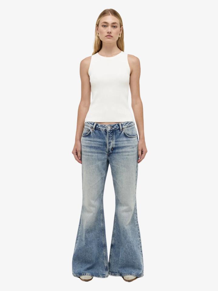 Image of a model wearing Denim. Productname: Neuw Chloe Baggy Flare in MID VINTAGE INDIGO colour by brand - Neuw