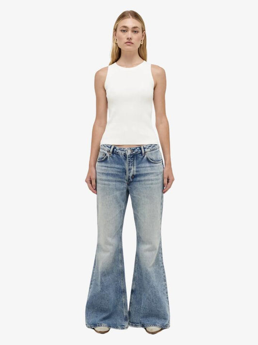 Image of a model wearing Denim. Productname: Neuw Chloe Baggy Flare in MID VINTAGE INDIGO colour by brand - Neuw