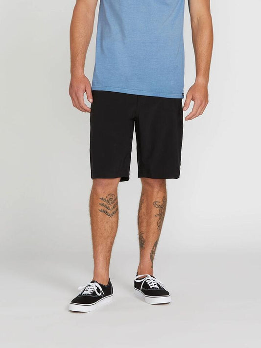 Image of a model wearing Shorts. Productname: Volcom - Mens Kerosene Hybrid Shorts - Black - in Black colour by brand - Volcom