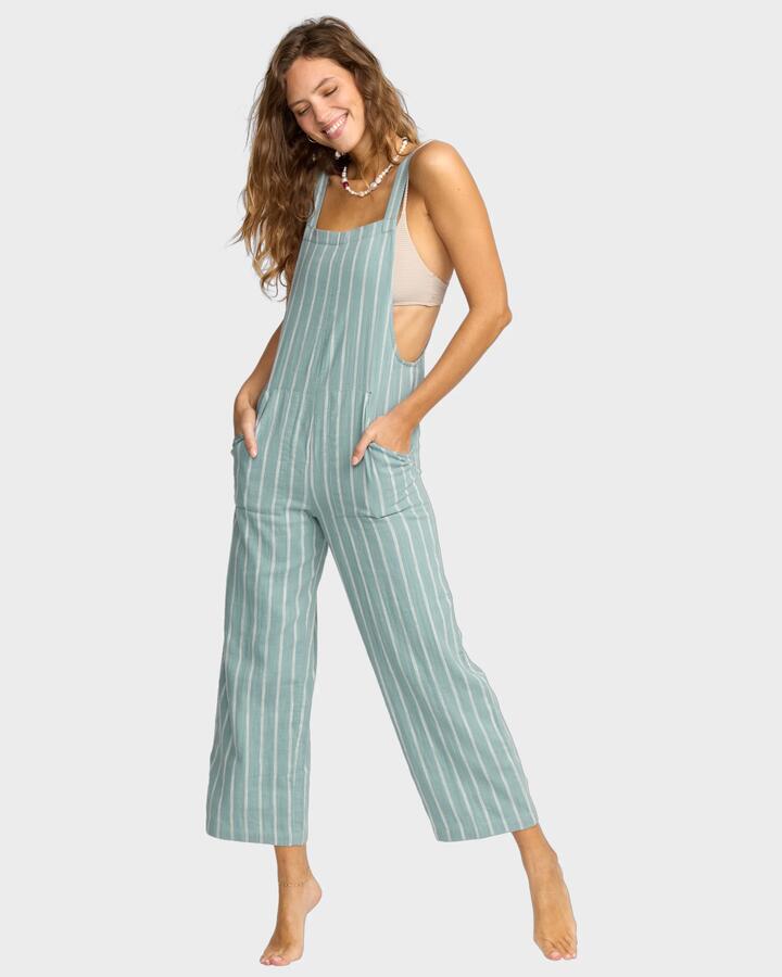 Image of a model wearing Pants. Product name - Billabong Womens Pacific Time Overalls Blue Fog in Blue Fog colour by brand - Billabong