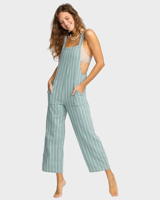 Image of a model wearing Pants. Product name - Billabong Womens Pacific Time Overalls Blue Fog in Blue Fog colour by brand - Billabong