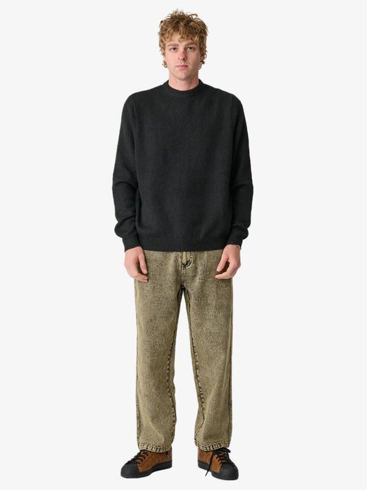 Image of a model wearing Denim. Productname: Xlarge Bull Denim 91 Pant in Sand Wash colour by brand - Xlarge