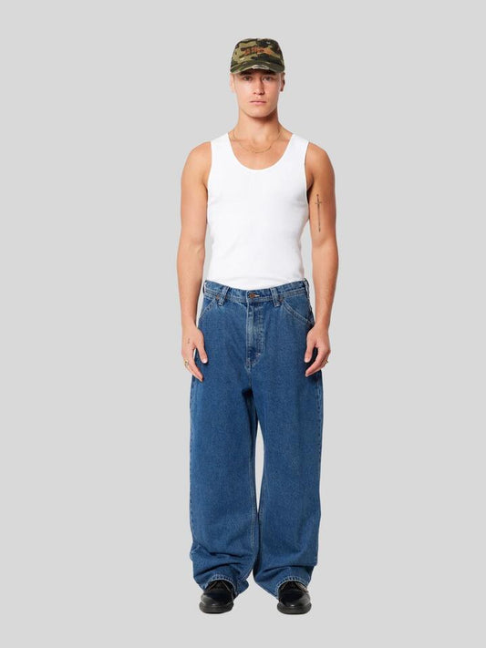 Image of a model wearing Denim. Productname: Abrand A6 Big Baggy Brett in Mid Vintage Indigo colour by brand - Abrand