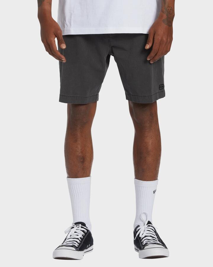 Image of a model wearing Shorts. Productname: Billabong - Mens Crossfire 18" Hybrid Shorts - Washed Black - in Washed Black colour by brand - Billabong