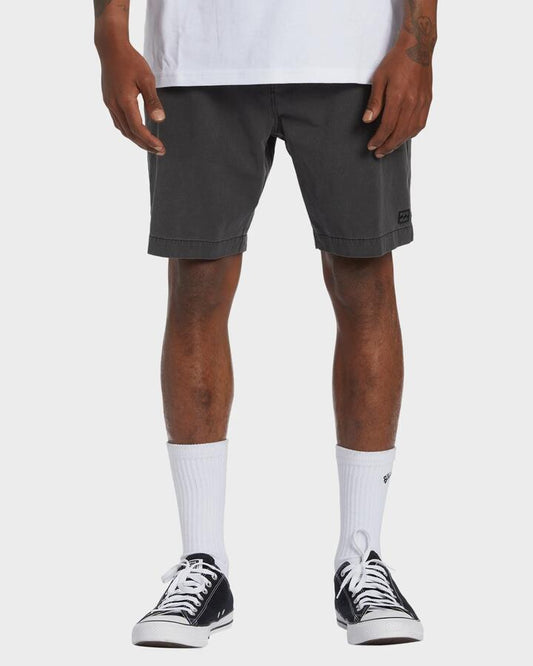 Image of a model wearing Shorts. Product name - Billabong Mens Crossfire 18" Hybrid Shorts Washed Black - in Washed Black colour by brand - Billabong