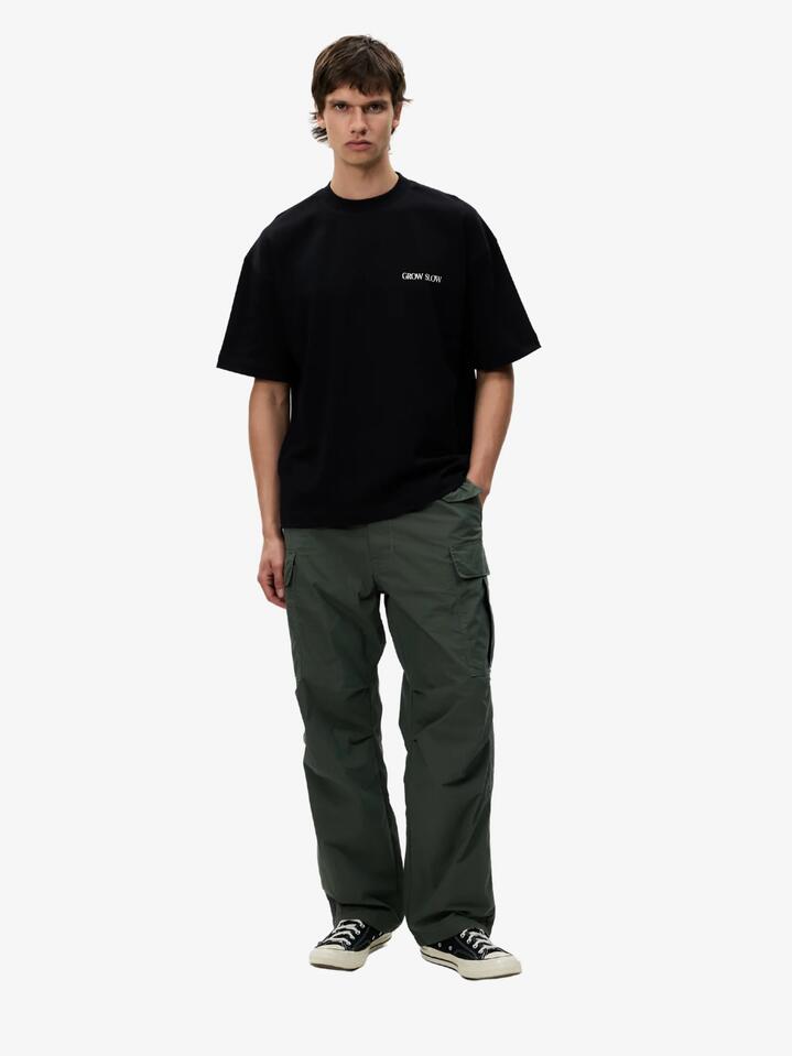Image of a model wearing Pants. Productname: Article One Flight Cargo in Olive colour by brand - Article One