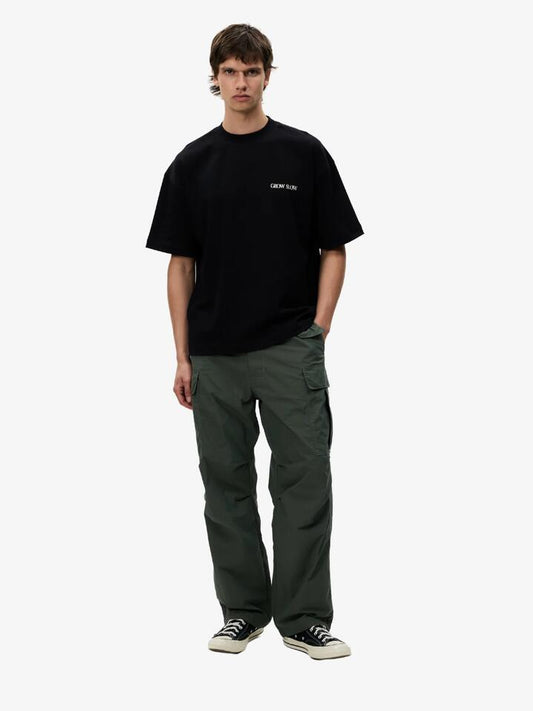 Image of a model wearing Denim. Productname: Article One Flight Cargo in Olive colour by brand - Article One