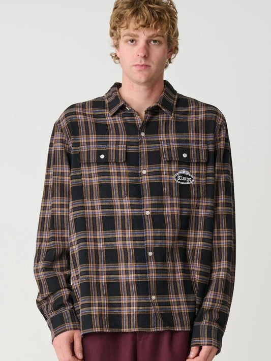 Image of a model wearing Tops. Productname: Xlarge Patch Stripe Long Sleeve Shirt in Snowmarle colour by brand - Xlarge