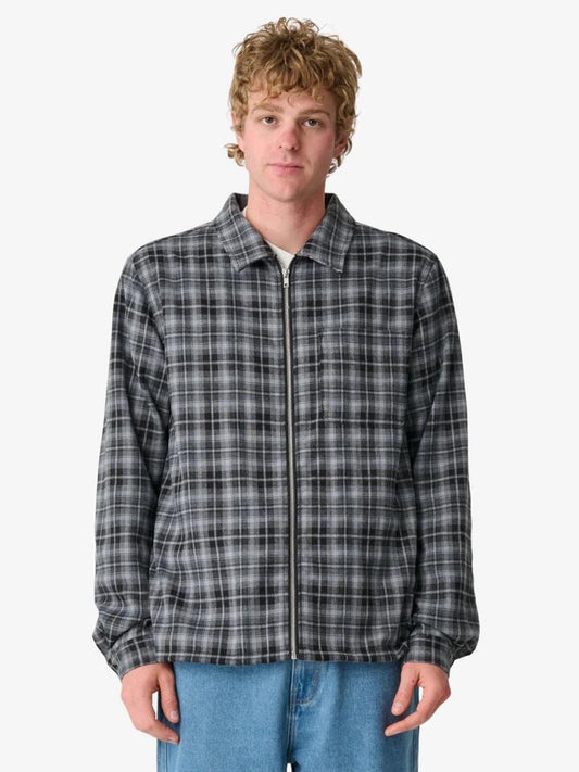 Image of a model wearing Tops. Productname: Xlarge 91 Long Sleeve Zip Shirt in Black colour by brand - Xlarge