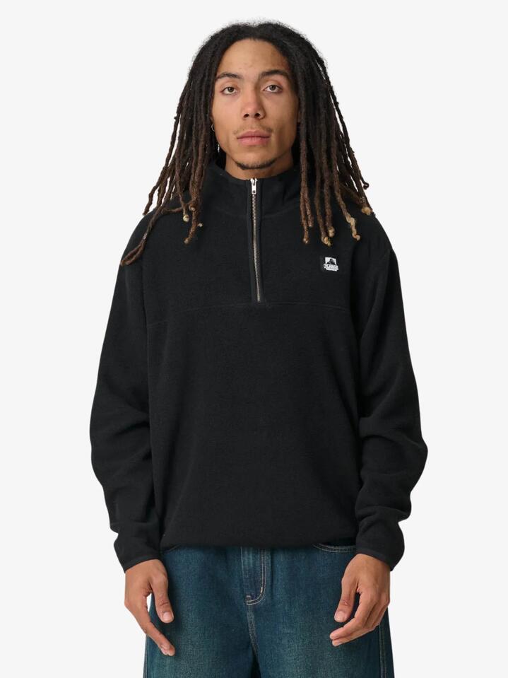 Image of a model wearing Outerwear. Productname: Xlarge Half Zip Crew in Black colour by brand - Xlarge