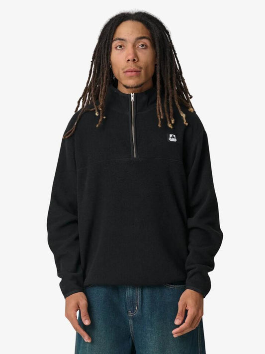 Image of a model wearing Outerwear. Productname: Xlarge Half Zip Crew in Black colour by brand - Xlarge
