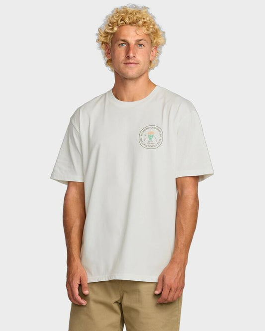 Image of a model wearing Tops. Productname: Billabong - Mens Desert Flower Regular T-Shirt - Off White - in Off White colour by brand - Billabong