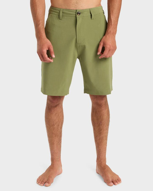 Image of a model wearing Shorts. Productname: Quiksilver - Mens Union Amphibian 20" Hybrid Shorts - Loden Green - in Loden Green colour by brand - Quiksilver