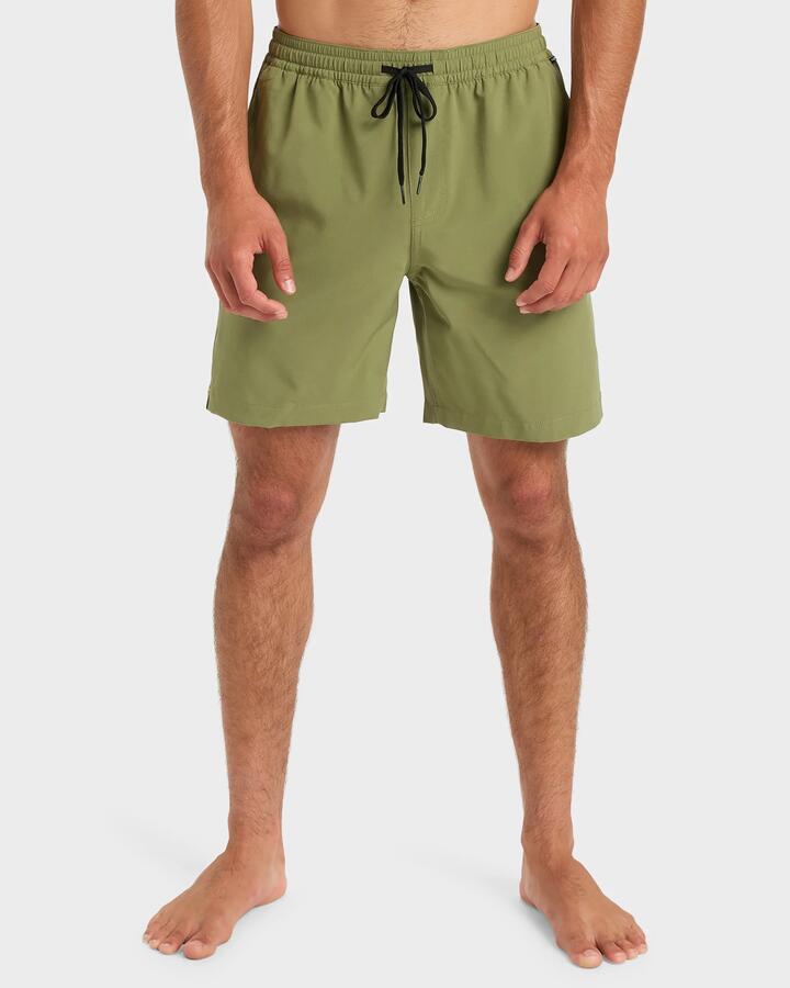 Image of a model wearing Shorts. Product name - Quiksilver Mens Taxer Amphibian 18" Hybrid Shorts Loden Green in Loden Green colour by brand - Quiksilver