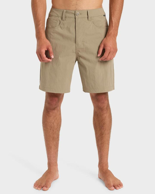 Image of a model wearing Shorts. Product name - Quiksilver Mens Nelson 18" Hybrid Shorts Fallen Rock in Fallen Rock colour by brand - Quiksilver