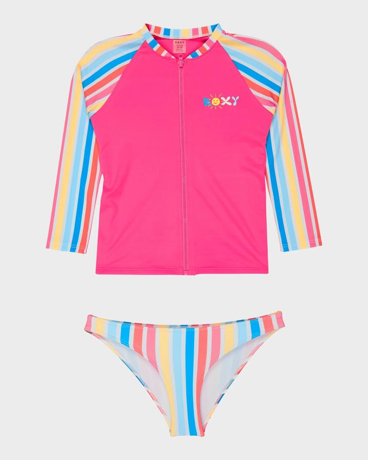 Image of a model wearing Tops. Product name - Roxy Girls 2-7 Holy Stripe Long Sleeve Rash Vest Bright White Holy Stripe in Bright White Holy Stripe colour by brand - Roxy