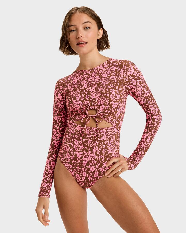 Image of a model wearing Tops. Product name - Roxy Womens Kerlina Long Sleeve Onesie Rash Vest Tiramisu Kerlina Border in Tiramisu Kerlina Border colour by brand - Roxy
