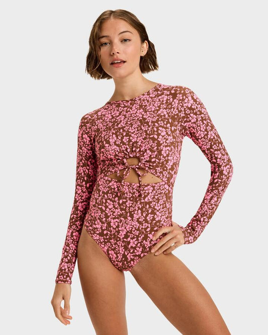 Image of a model wearing Tops. Product name - Roxy Womens Kerlina Long Sleeve Onesie Rash Vest Tiramisu Kerlina Border in Tiramisu Kerlina Border colour by brand - Roxy