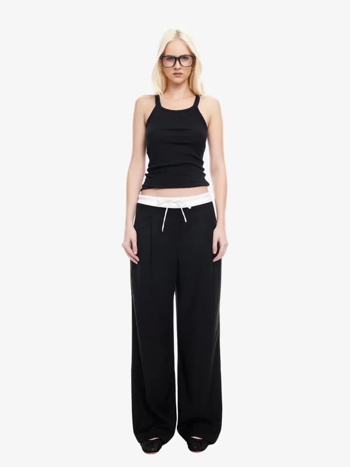 Image of a model wearing Pants. Productname: Lioness Frankie Pant in ONYX colour by brand - Lioness