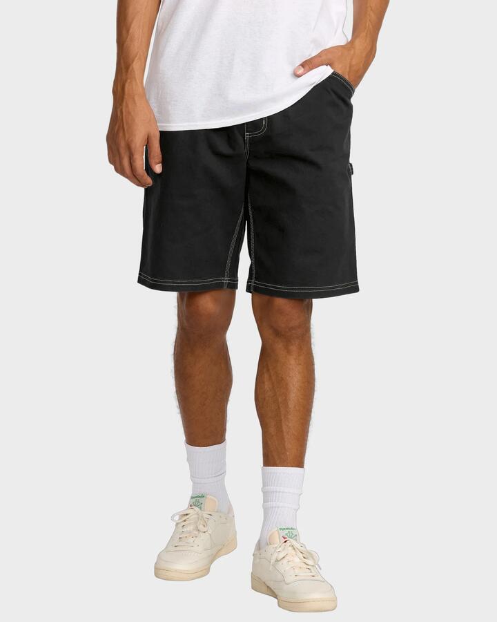 Image of a model wearing Shorts. Product name - RVCA Mens Americana Carpenter Walkshorts Rvca Black in Rvca Black colour by brand - RVCA