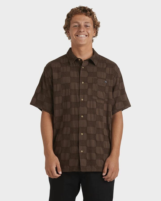 Image of a model wearing Tops. Productname: Billabong Mens Sundays Jaquard Short Sleeve Shirt Chocolate - in Chocolate colour by brand - Billabong