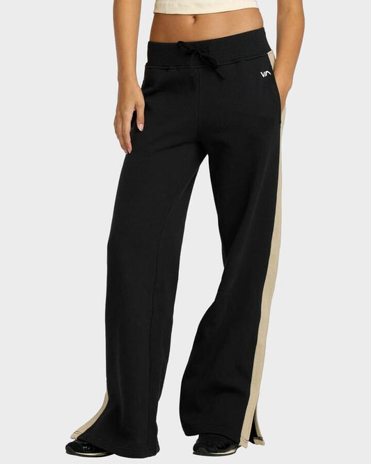 Image of a model wearing Pants. Productname: RVCA Womens Bench Warmer Elastic Waist Pants Black - in Black colour by brand - RVCA