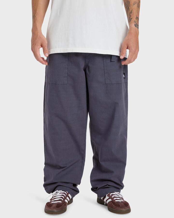 Image of a model wearing Pants. Product name - Quiksilver Mens Double Croen Pants India Ink in India Ink colour by brand - Quiksilver