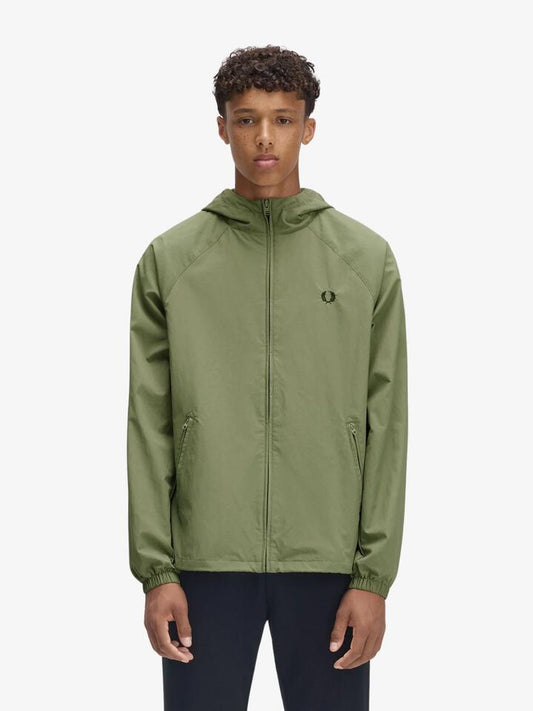 Image of a model wearing Outerwear. Productname: Fred Perry Taslan Hooded Shell Jacket in Olive Mint colour by brand - Fred Perry