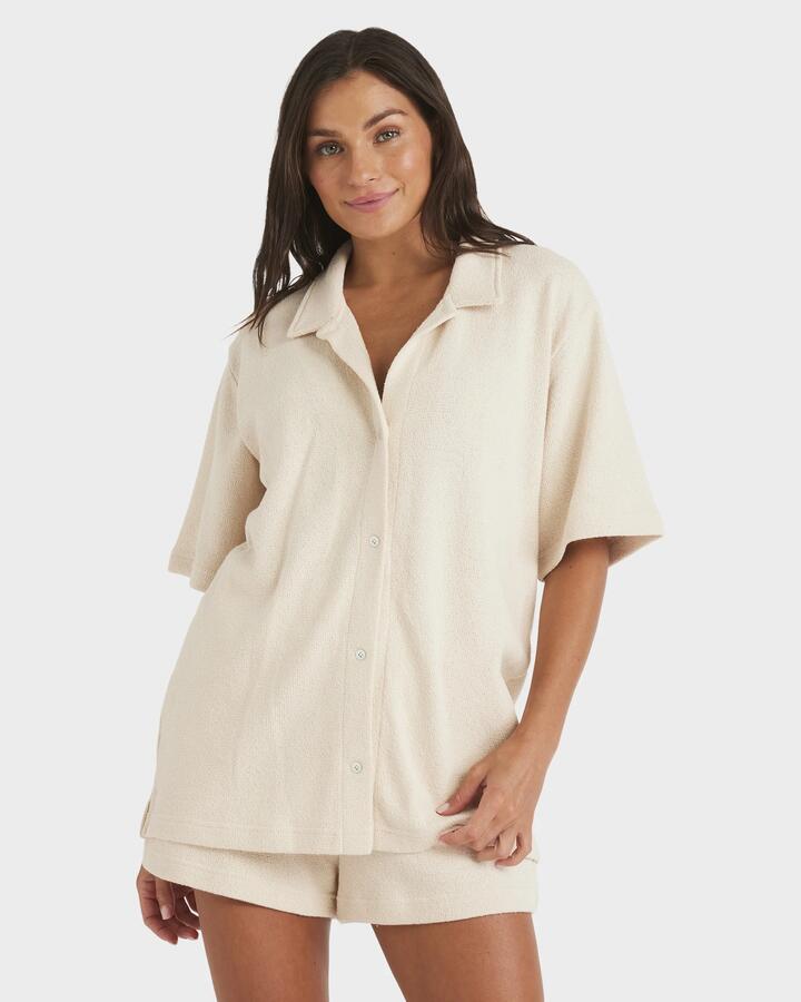 Image of a model wearing Tops. Product name - Roxy Womens Always Sunny Short Sleeve Shirt Parchment in Parchment colour by brand - Roxy