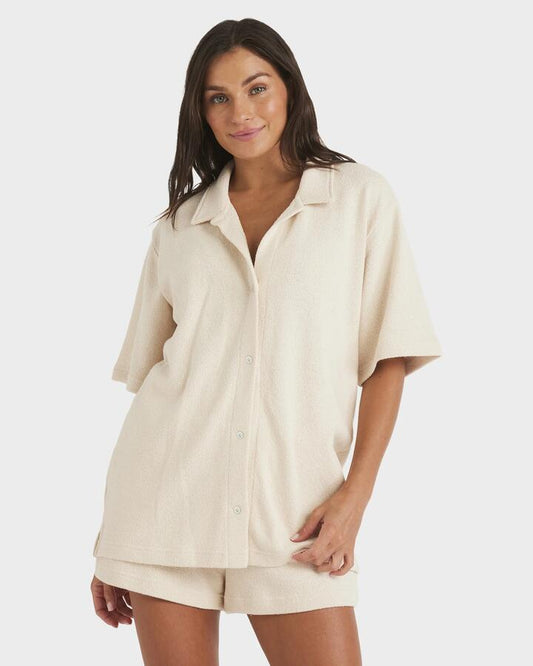 Image of a model wearing Tops. Product name - Roxy Womens Always Sunny Short Sleeve Shirt Parchment in Parchment colour by brand - Roxy