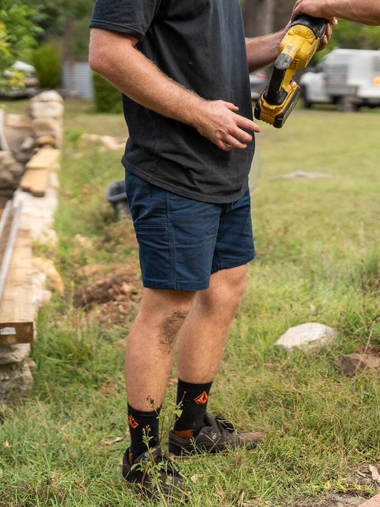 Image of a model wearing Uniforms & Workwear. Productname: Volcom - Mens Workwear Caliper Elastic Waist Walkshorts - Navy - in Navy colour by brand - Volcom