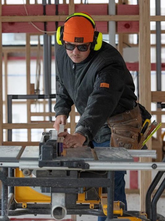 Image of a model wearing Uniforms & Workwear. Productname: Volcom - Mens Workwear Beanie - Orange - in Orange colour by brand - Volcom