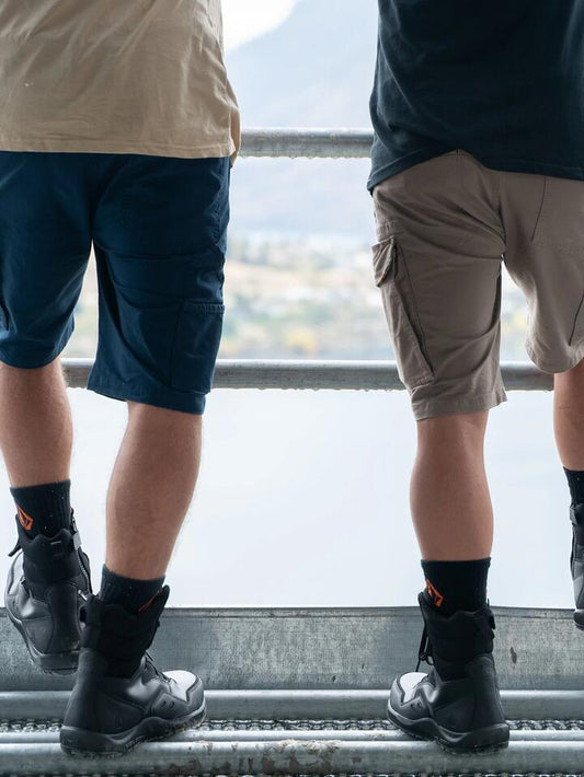 Image of a model wearing Shorts. Productname: Volcom - Mens Caliper 20" Carpenter Shorts - Navy - in Navy colour by brand - Volcom