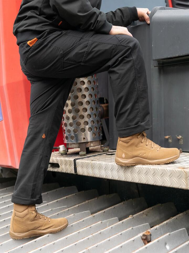 Image of a model wearing Pants. Product name - Volcom Mens Caliper Carpenter Pants Black in Black colour by brand - Volcom
