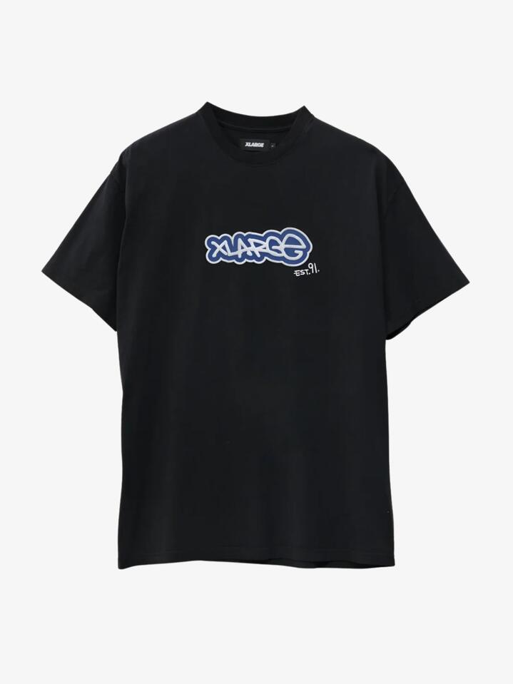Image of a model wearing Shorts. Productname: Xlarge Tag Short Sleeve in Pigment Black colour by brand - Xlarge