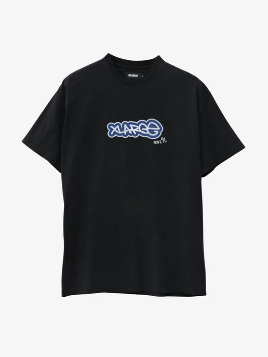 Image of a model wearing Shorts. Productname: Xlarge Tag Short Sleeve in Pigment Black colour by brand - Xlarge